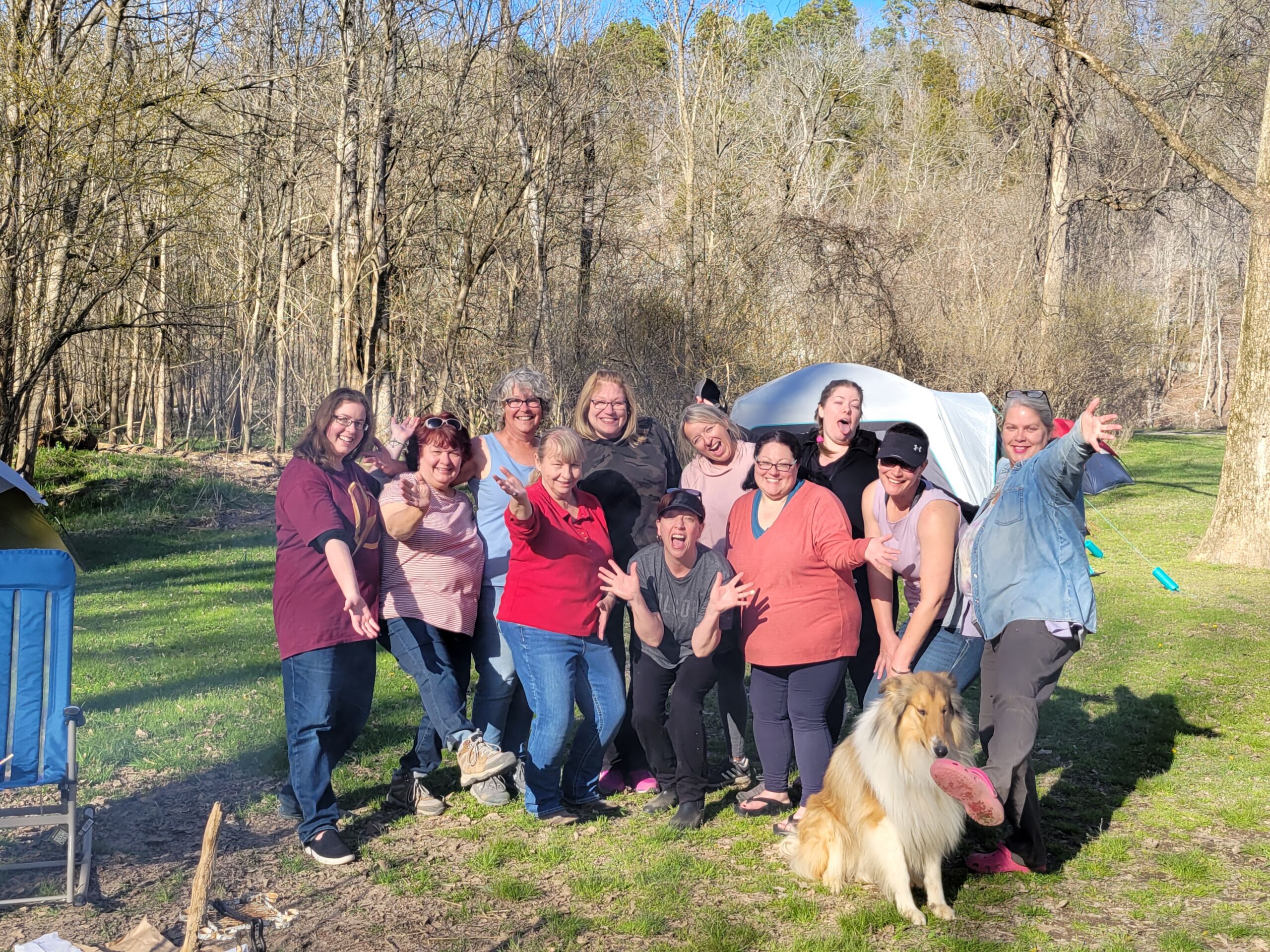 11 women in a group camping photo