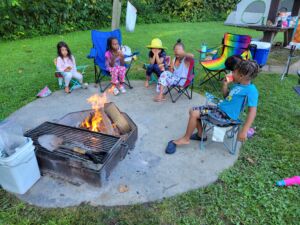 Grandchildren around a fire