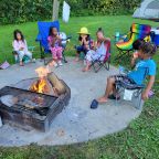 Grandchildren around a fire