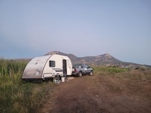 RV with mountains in the background - boondocking