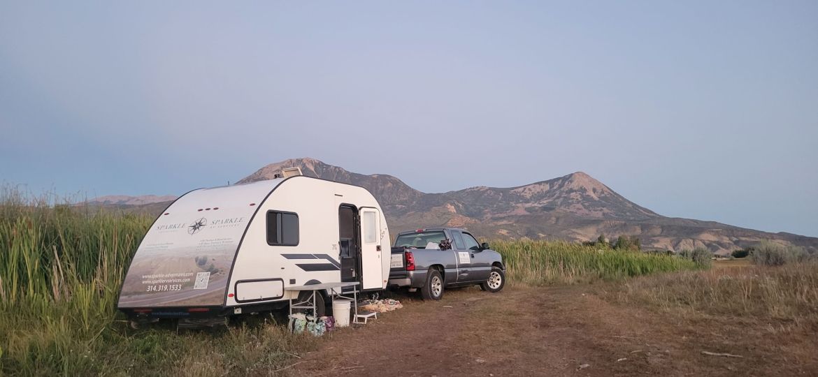 RV with mountains in the background - boondocking