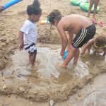 kids building a sand castle