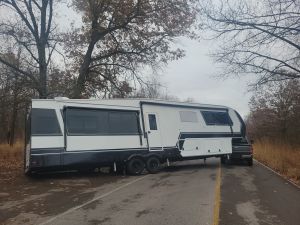 RV tilted after taking a turn to sharp, wheel went off the road